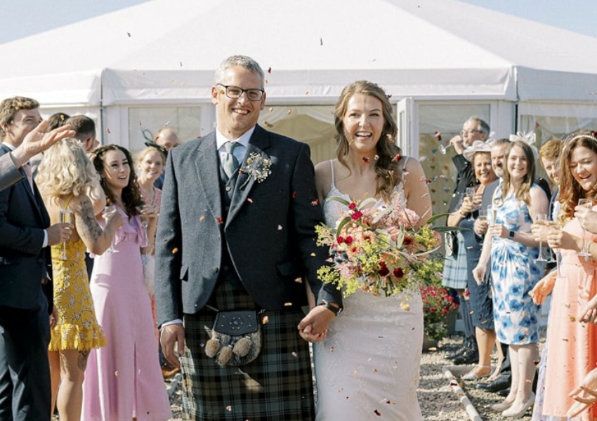 Nrthersands happy couple by the marquee